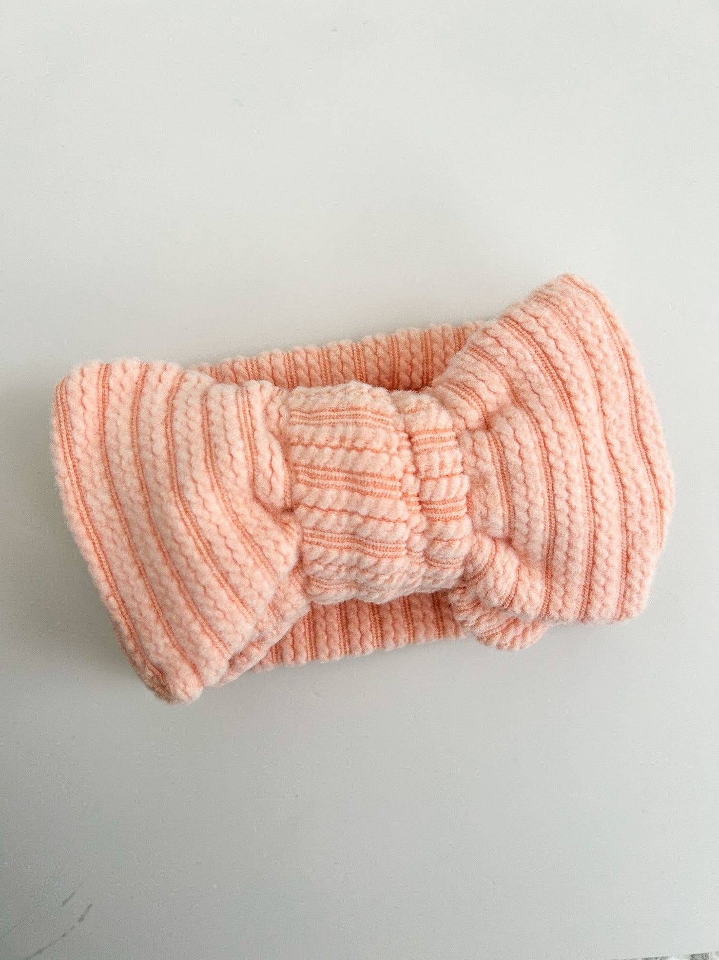 OVERSIZED CABLE RIBBED BOW HEADBAND - CORAL