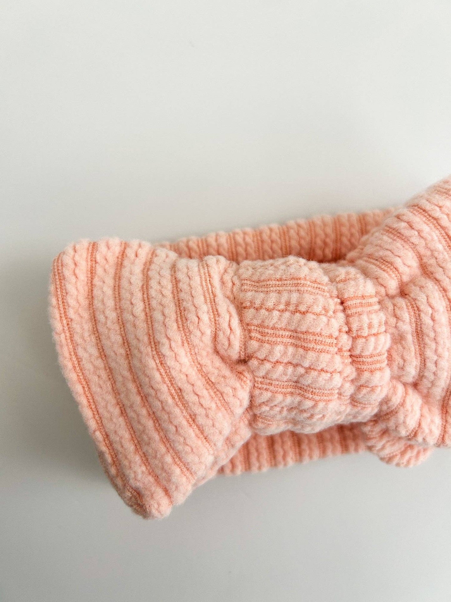 OVERSIZED CABLE RIBBED BOW HEADBAND - CORAL